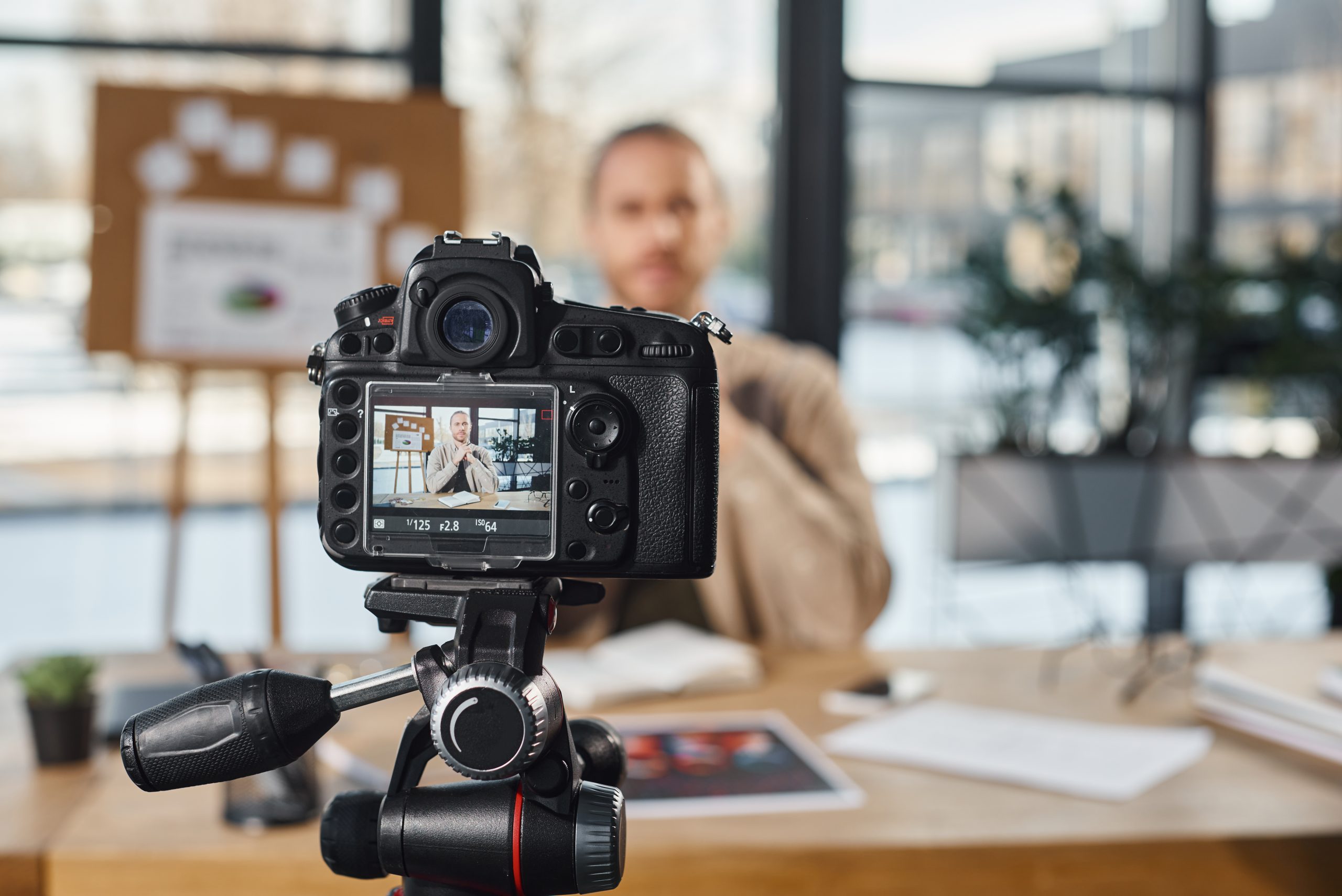 Selective focus of professional digital camera near businessman recording video content in office lightfield studios   stock Adobe Com selective focus of professional digital camera near businessman recording video content in office cutting edge marketing techniques that will boost your sales in 2026 2027 and beyond